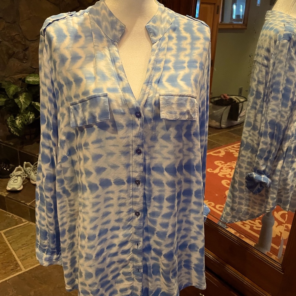 Blouse is a buttery soft blue and white tie-dye with roll up sleeves.